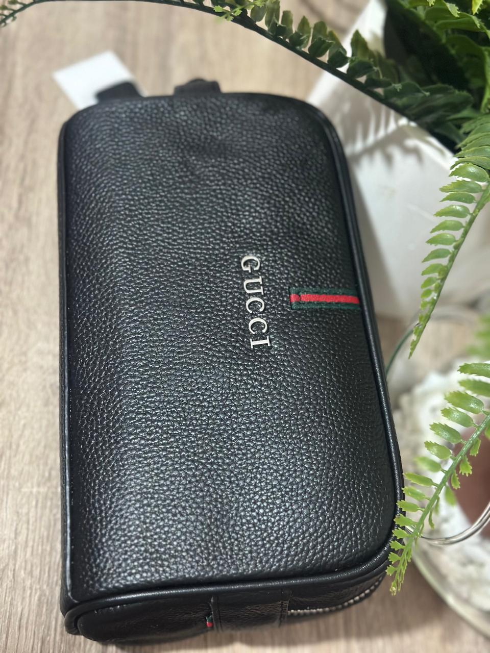Gucci Pebbled Leather Travel Sling Bag